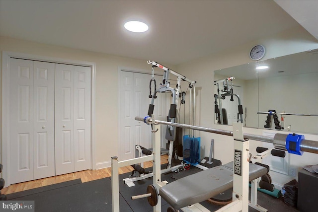 exercise area featuring hardwood / wood-style floors