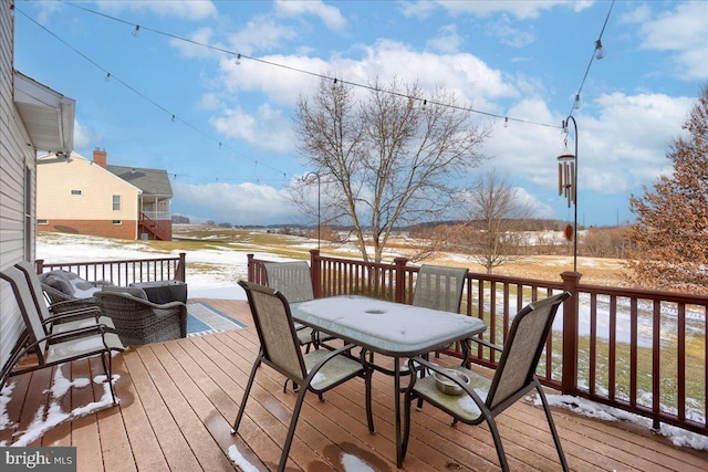 snow covered deck featuring outdoor lounge area