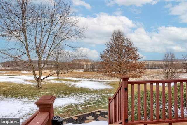 yard covered in snow featuring a wooden deck