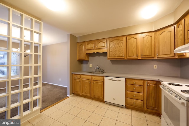 kitchen with white appliances, sink, and light tile patterned floors