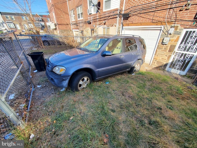 view of parking with cooling unit