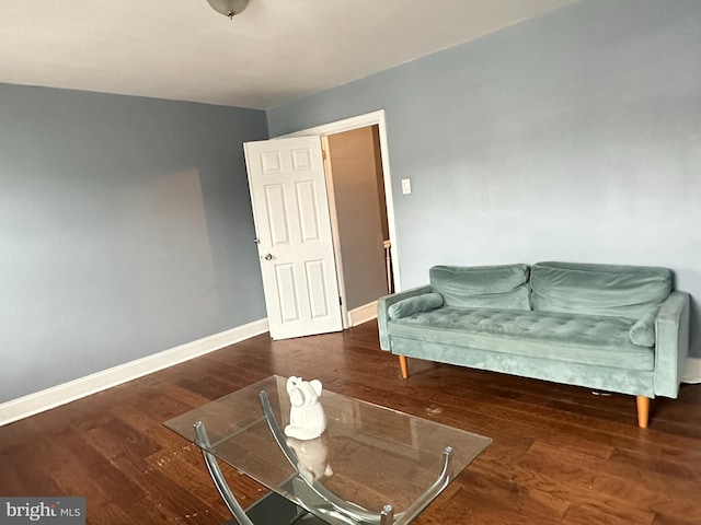 living room with dark hardwood / wood-style flooring