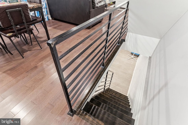 stairway featuring hardwood / wood-style flooring