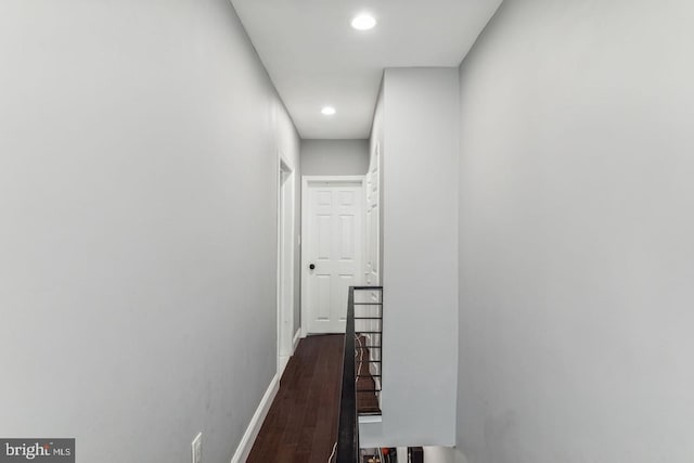 corridor featuring dark wood-type flooring