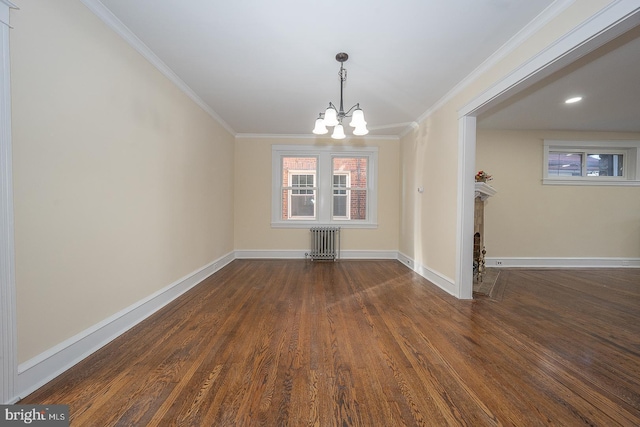 unfurnished dining area featuring radiator, dark wood-type flooring, a chandelier, and ornamental molding