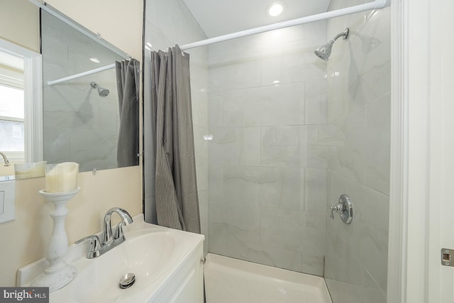 bathroom with a shower with curtain and sink