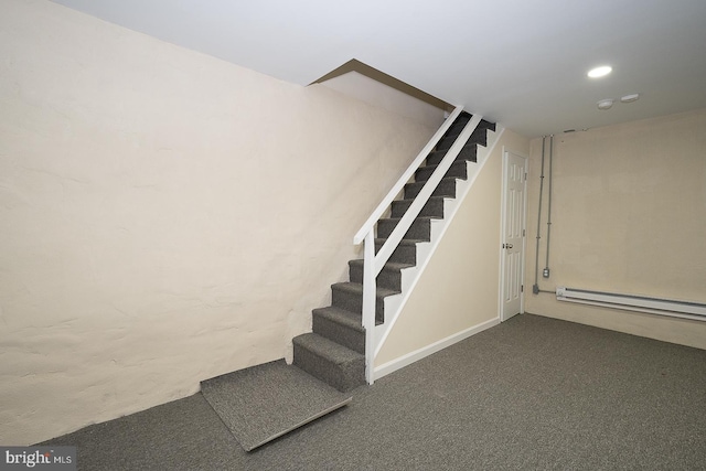 stairs with carpet and a baseboard radiator