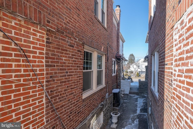 view of side of home featuring central AC unit