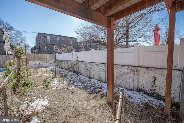 view of yard covered in snow