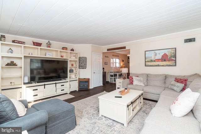 living room with wooden ceiling, hardwood / wood-style flooring, and crown molding