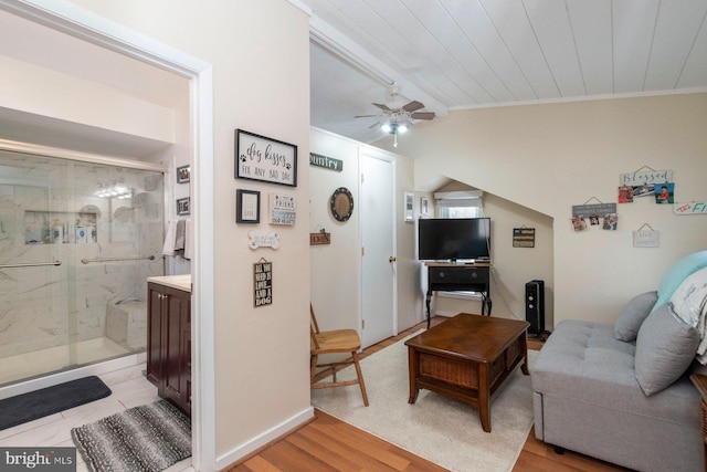 living room featuring light hardwood / wood-style flooring, ceiling fan, lofted ceiling, and wood ceiling