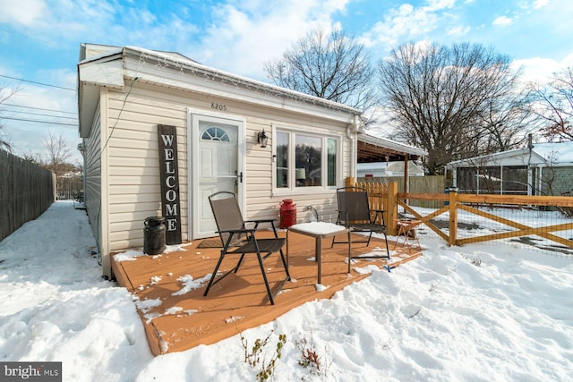 view of snow covered deck