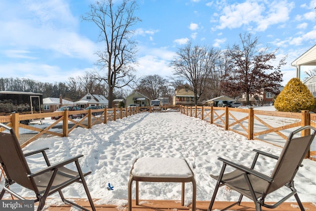 view of yard layered in snow