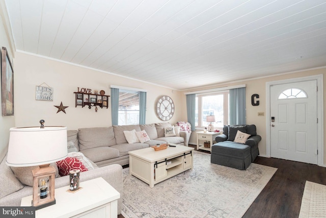 living room featuring hardwood / wood-style floors, crown molding, and wood ceiling