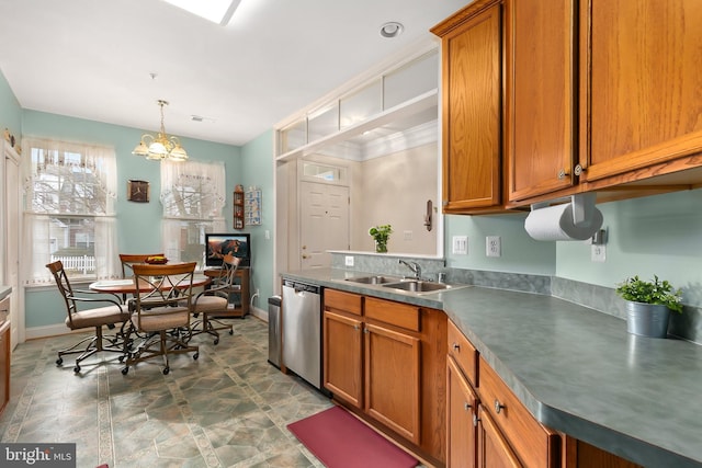 kitchen with hanging light fixtures, a chandelier, sink, and stainless steel dishwasher