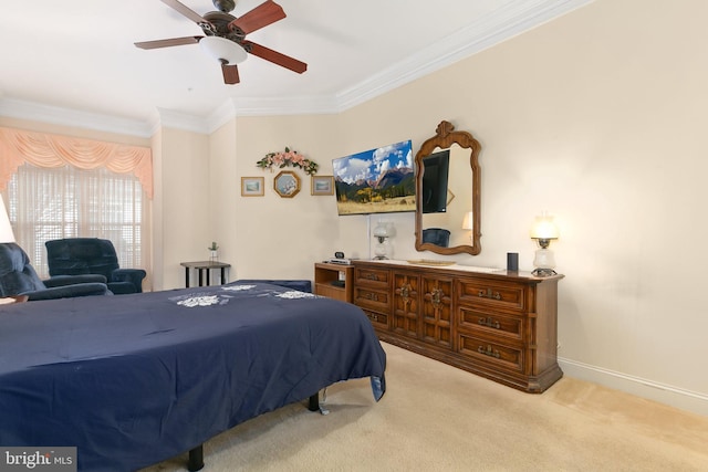 carpeted bedroom with ceiling fan and crown molding