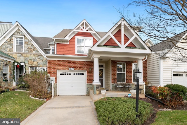 view of front of property featuring covered porch and a garage