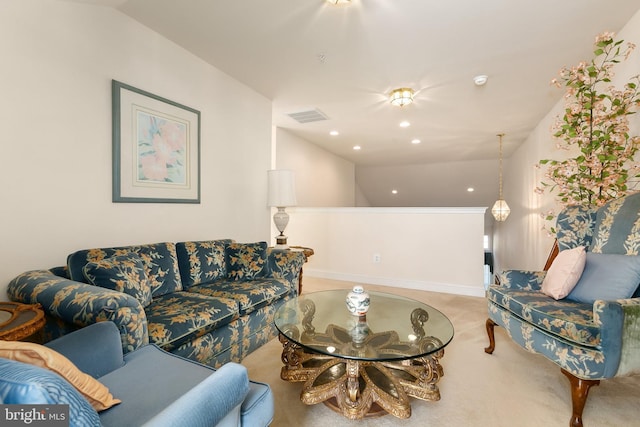 living room with carpet flooring and vaulted ceiling