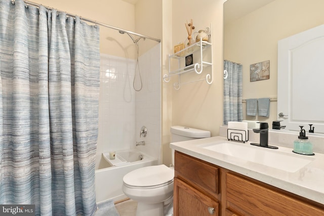 full bathroom featuring shower / tub combo, vanity, and toilet