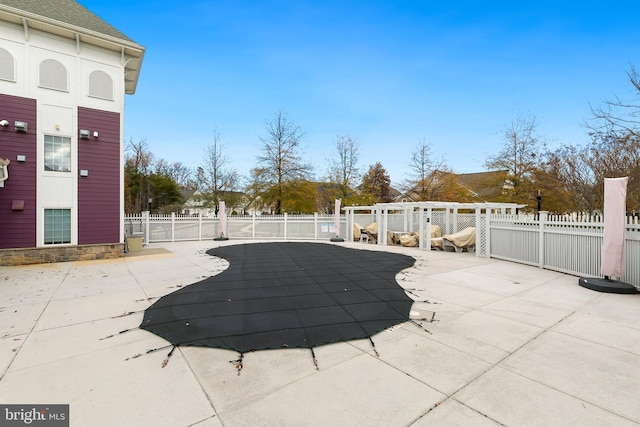 view of swimming pool with a patio area