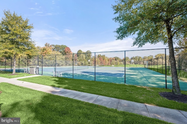 view of sport court featuring a yard