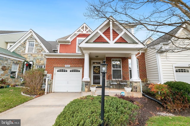 view of front of property with a porch and a garage