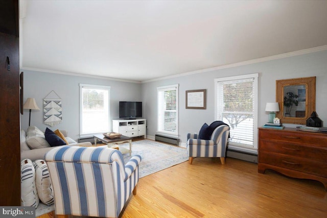 living room with hardwood / wood-style flooring, plenty of natural light, and crown molding