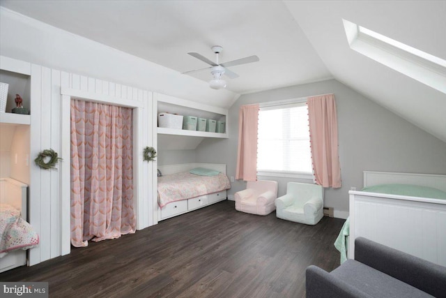 bedroom with ceiling fan, dark wood-type flooring, and vaulted ceiling