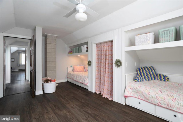 bedroom with ceiling fan, dark hardwood / wood-style flooring, and lofted ceiling