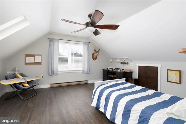 bedroom featuring baseboard heating, ceiling fan, dark hardwood / wood-style flooring, and vaulted ceiling