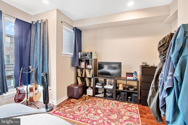 bedroom with wood-type flooring