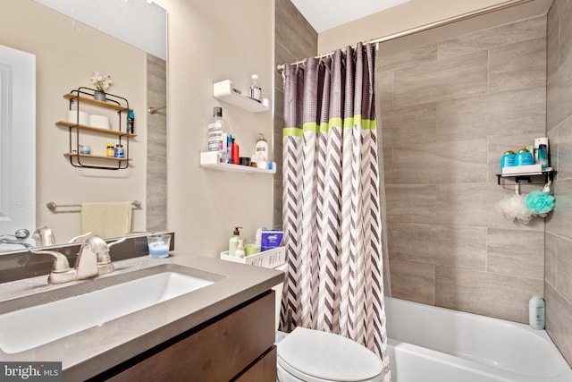 full bathroom featuring shower / bath combo, toilet, and vanity