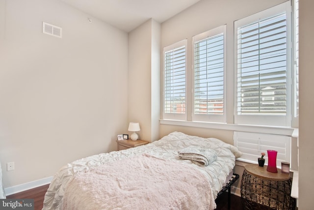 bedroom featuring dark wood-type flooring