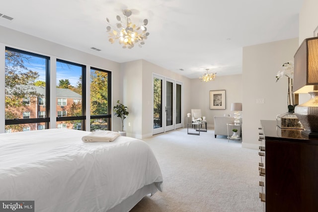 bedroom with a chandelier, light colored carpet, visible vents, and baseboards