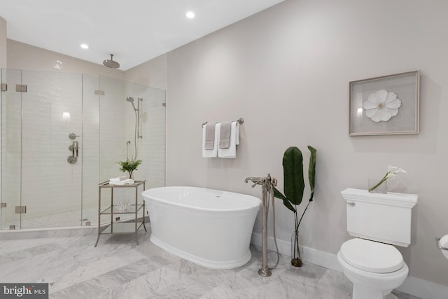 full bathroom with toilet, baseboards, a freestanding bath, marble finish floor, and a shower stall