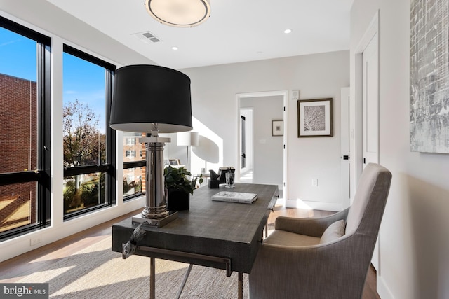 office featuring recessed lighting, visible vents, and wood finished floors