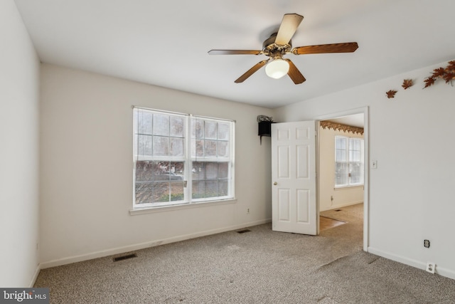 unfurnished bedroom featuring carpet and ceiling fan