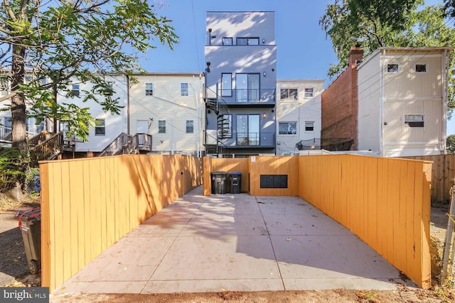 back of property with a patio