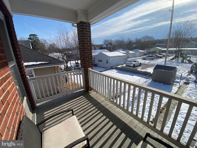 view of snow covered deck