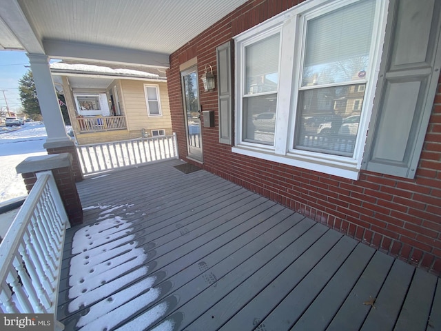 wooden deck featuring covered porch