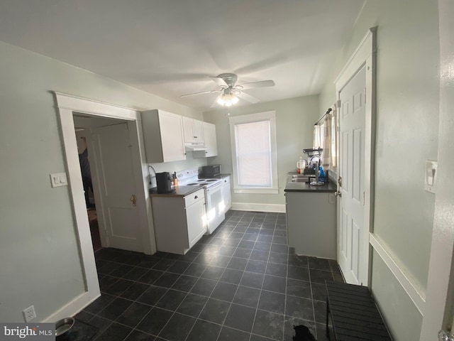 kitchen featuring white cabinetry, sink, white electric stove, and ceiling fan