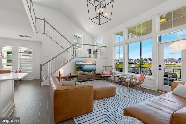 sunroom / solarium with a notable chandelier