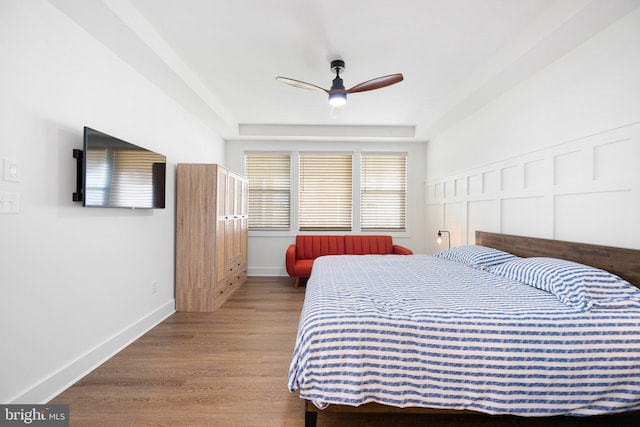 bedroom with hardwood / wood-style flooring and ceiling fan