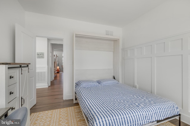 bedroom featuring hardwood / wood-style floors