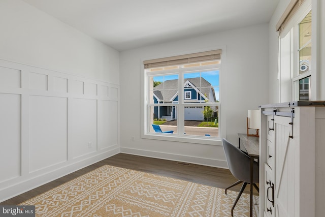 office space featuring hardwood / wood-style floors and a healthy amount of sunlight