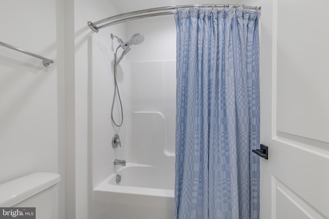 bathroom featuring toilet and shower / bathtub combination with curtain