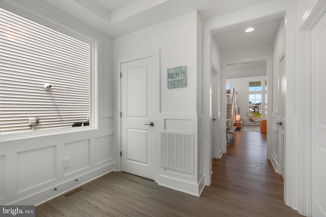 hallway with dark wood-type flooring