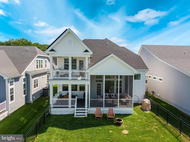 back of house with a yard, a balcony, central AC, and a sunroom