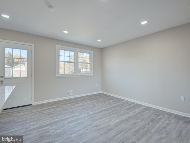 unfurnished room featuring light wood-type flooring