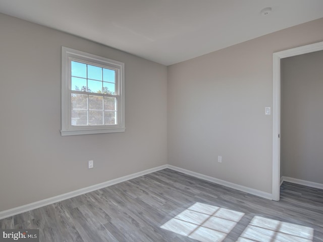 spare room featuring light hardwood / wood-style flooring